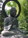 Large bronze Buddha seated in the Japanese Garden.